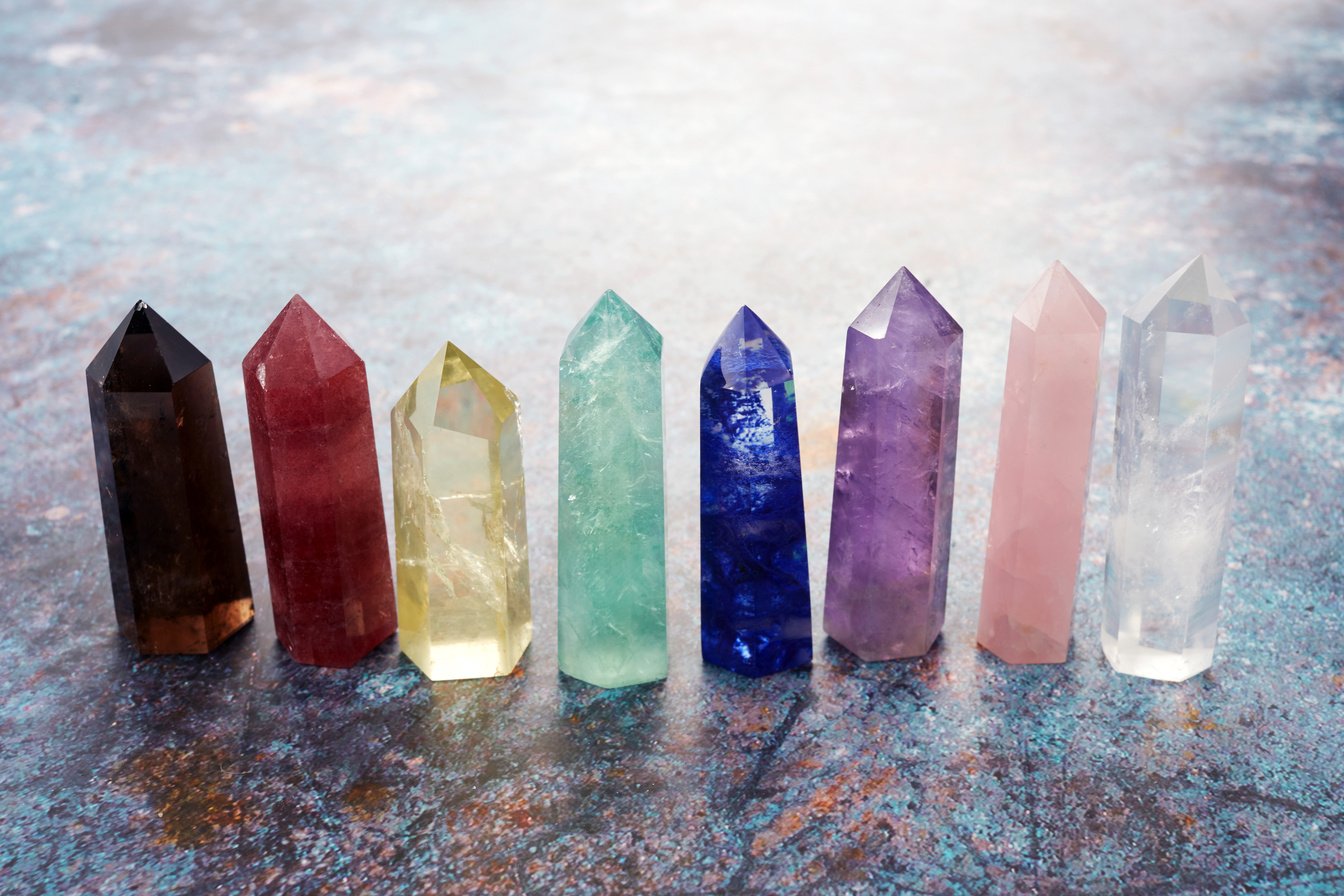 Healing Chakra Crystals on Marble Background